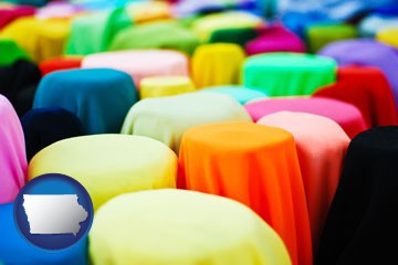 bolts of fabric in a fabric shop - with Iowa icon